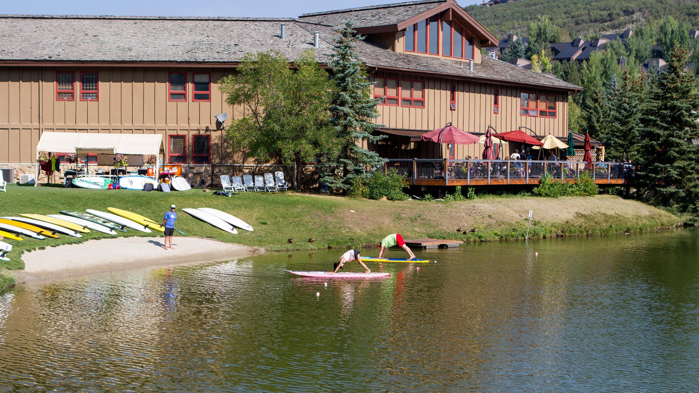Guests doing a paddle board yoga class