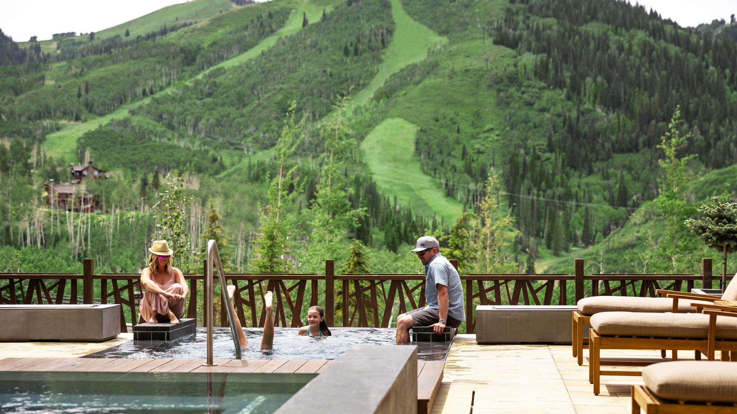 A family at the pool at One Empire Pass