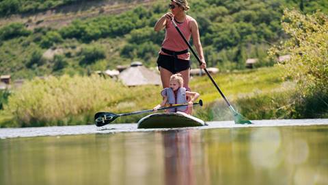 SUP Mom and daughter on a paddle board