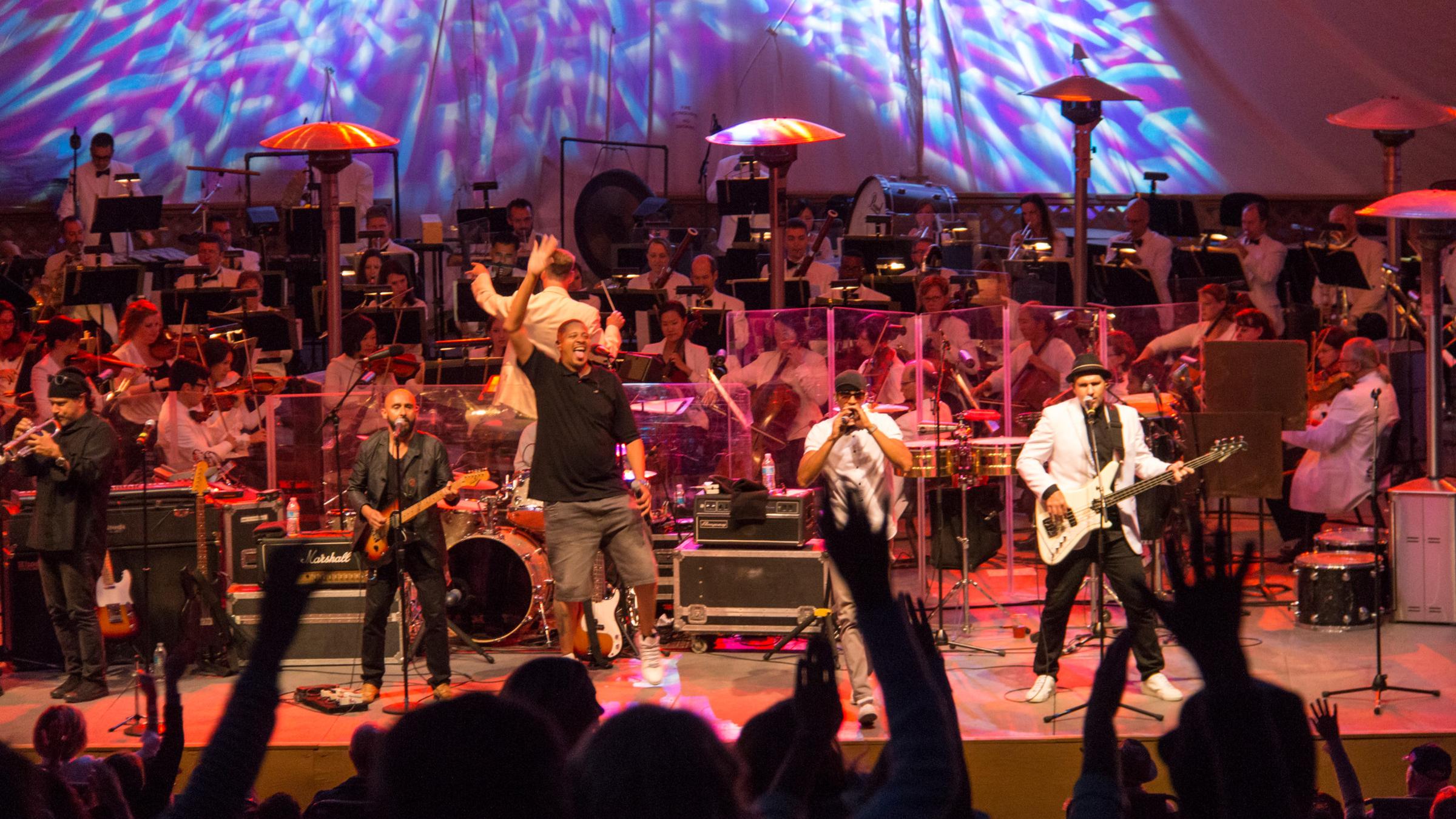 A band and Utah Symphony performing at Snow Park Outdoor Amphitheater