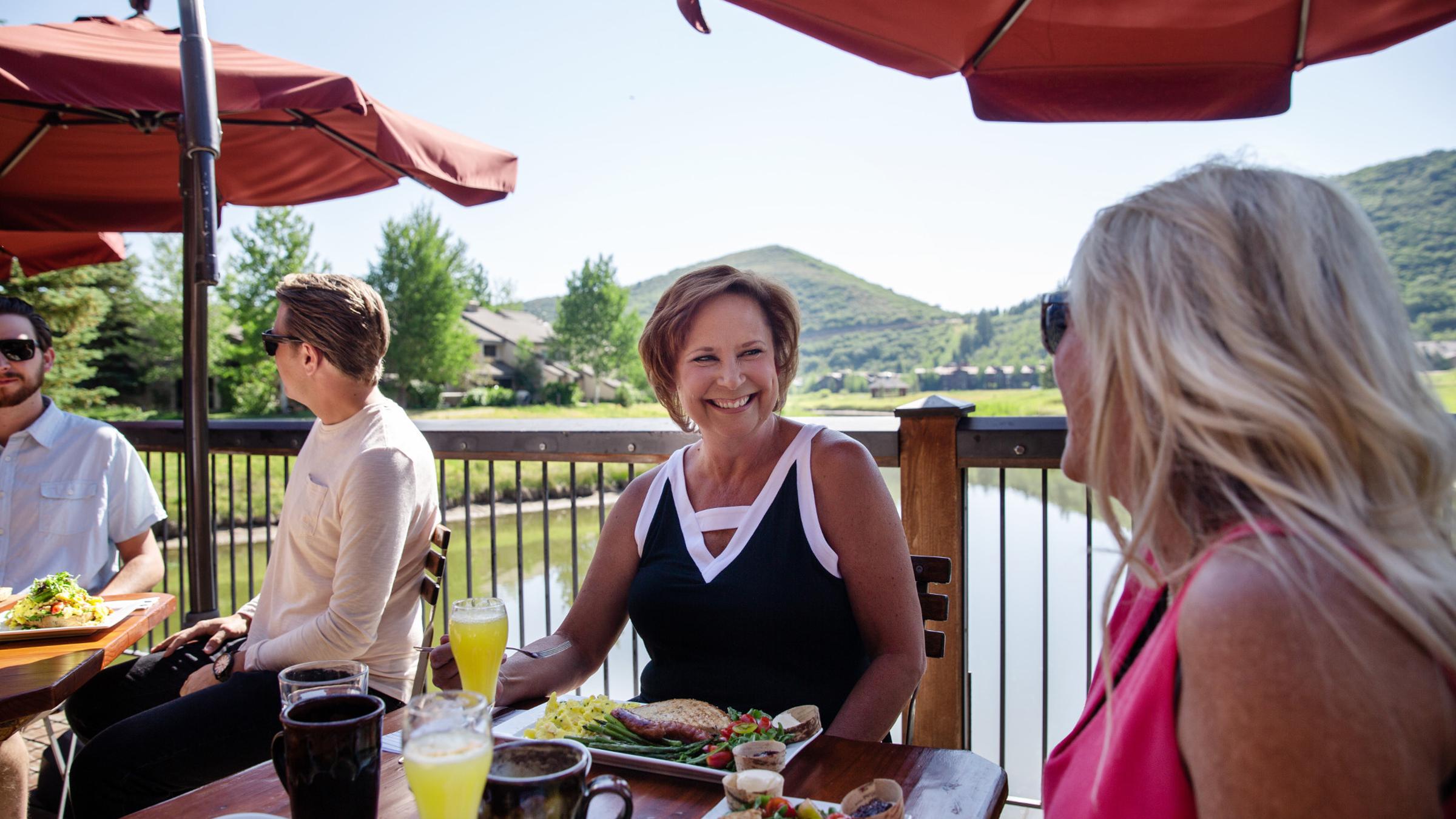 Guests dining on the deck at Deer Valley Grocery Cafe at Deer Valley in Park City, UT