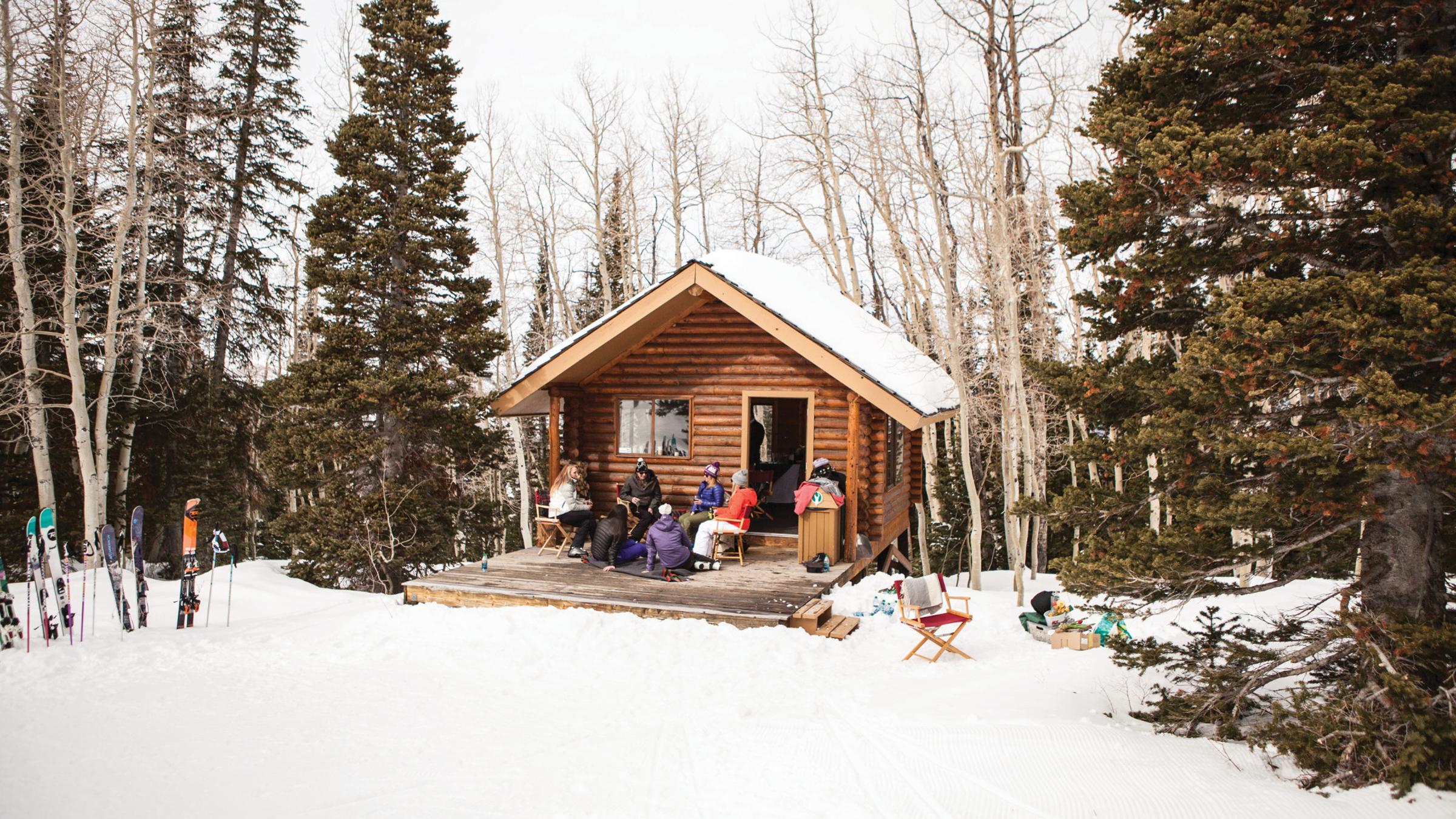 A group of guests sitting outside at Sunset Cabin