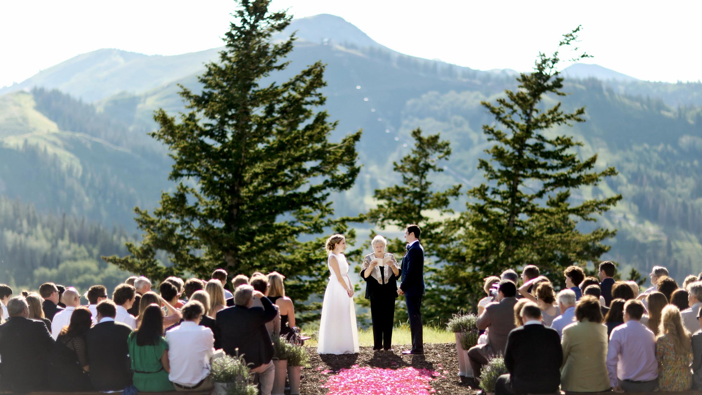 An outdoor wedding ceremony at Cushings Cabin