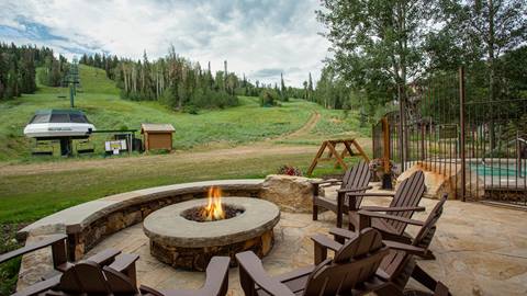 Grand Lodge outdoor firepit with Northside chairlift in the background