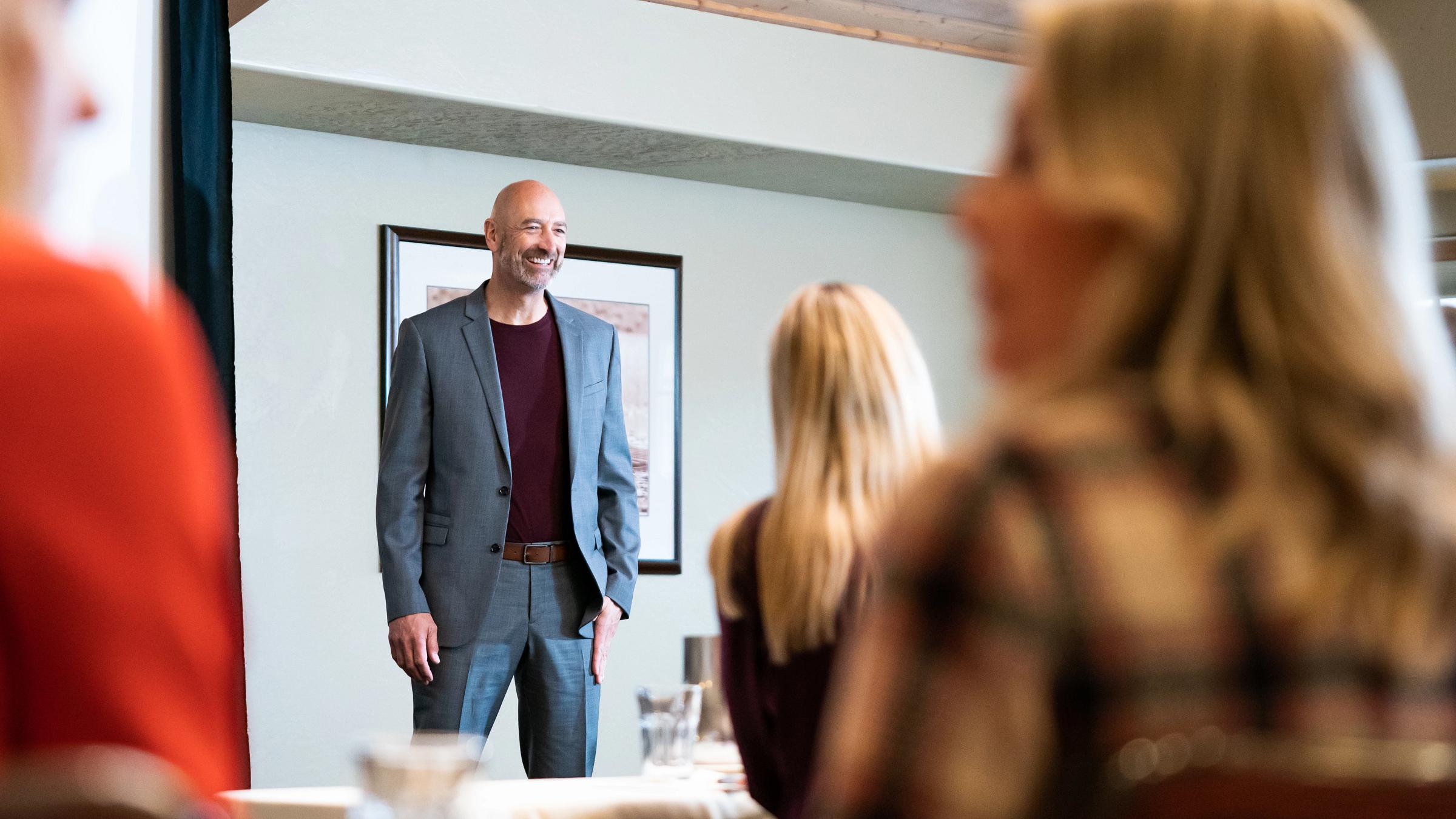 Presenter delivering speech in a Deer Valley conference room