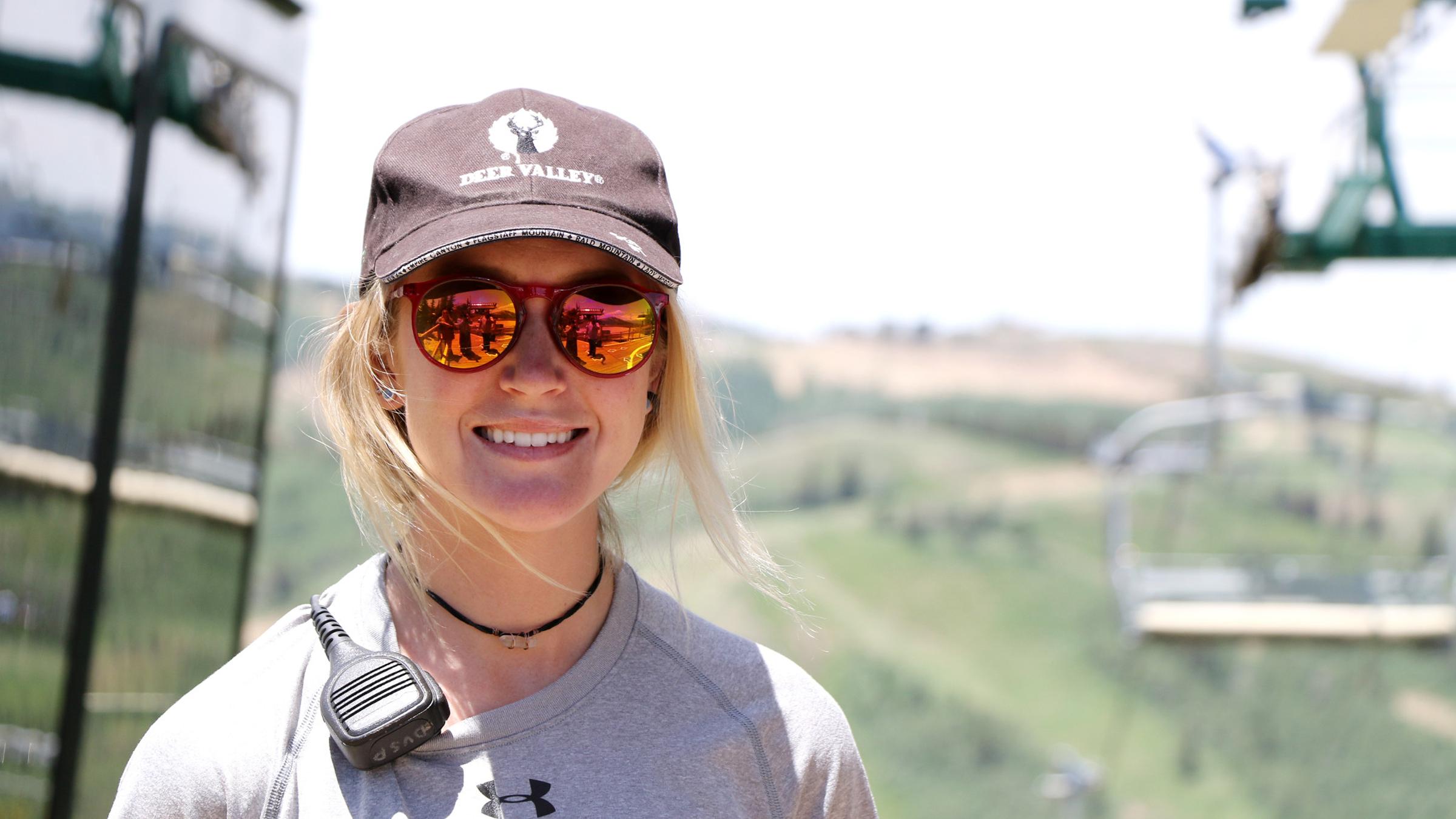 A female lift operator smiling